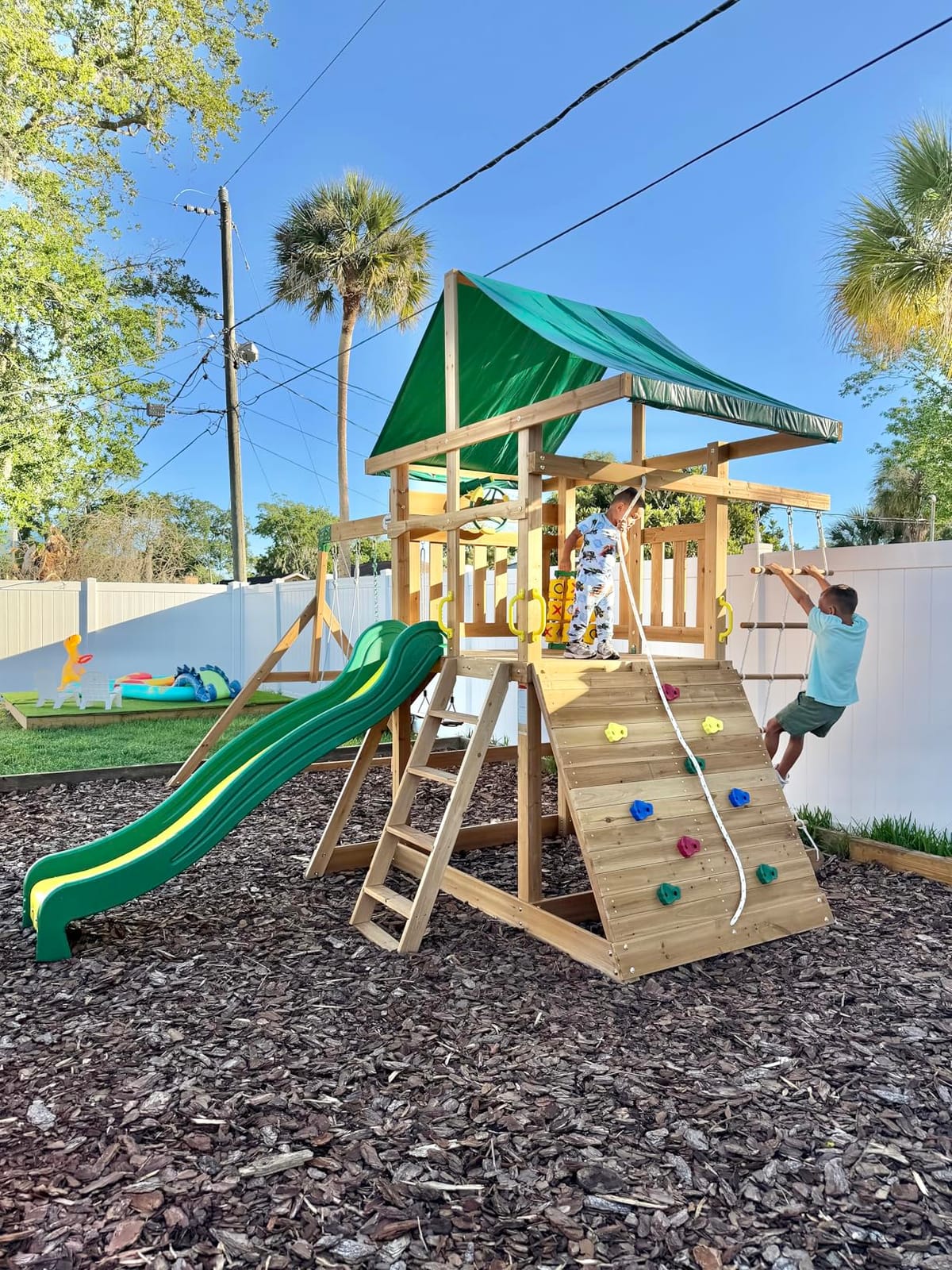 Backyard Discovery Mount Mckinley Cedar Wood Swing Set with Wave Slide, Play Deck, Double Rock Wall, Rope Ladder, Web Swing, Belt Swings, Toy Telescope, Steering Wheel, Sandbox Area, Outdoor Playset customer photo 1