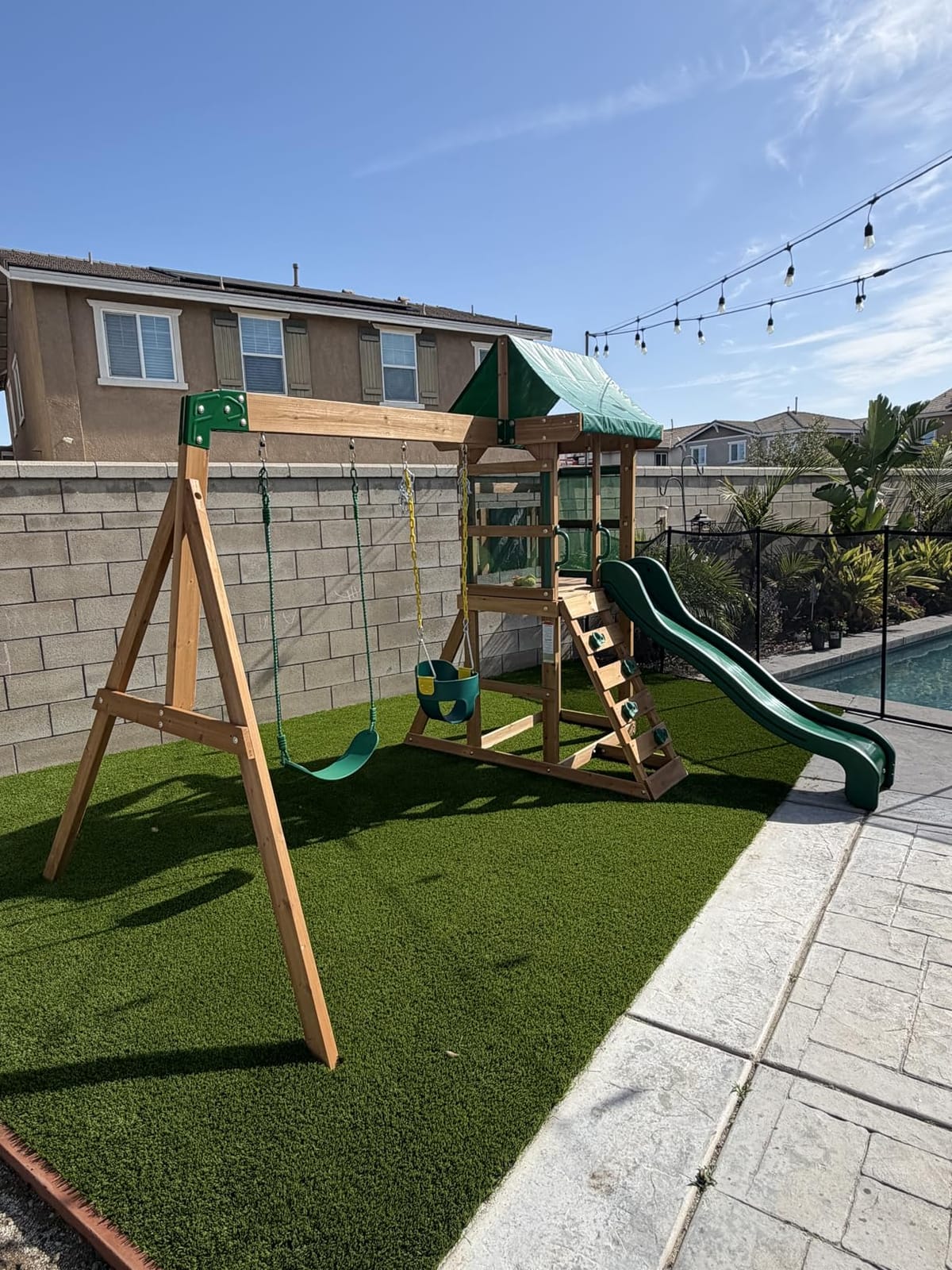 Backyard Discovery Buckley Hill Cedar Wood Swing Set with Wave Slide, Play Deck, Rock Wall Ladder, Belt Swings, Chalkboard, Canopy Roof, Outdoor Playset customer photo 1