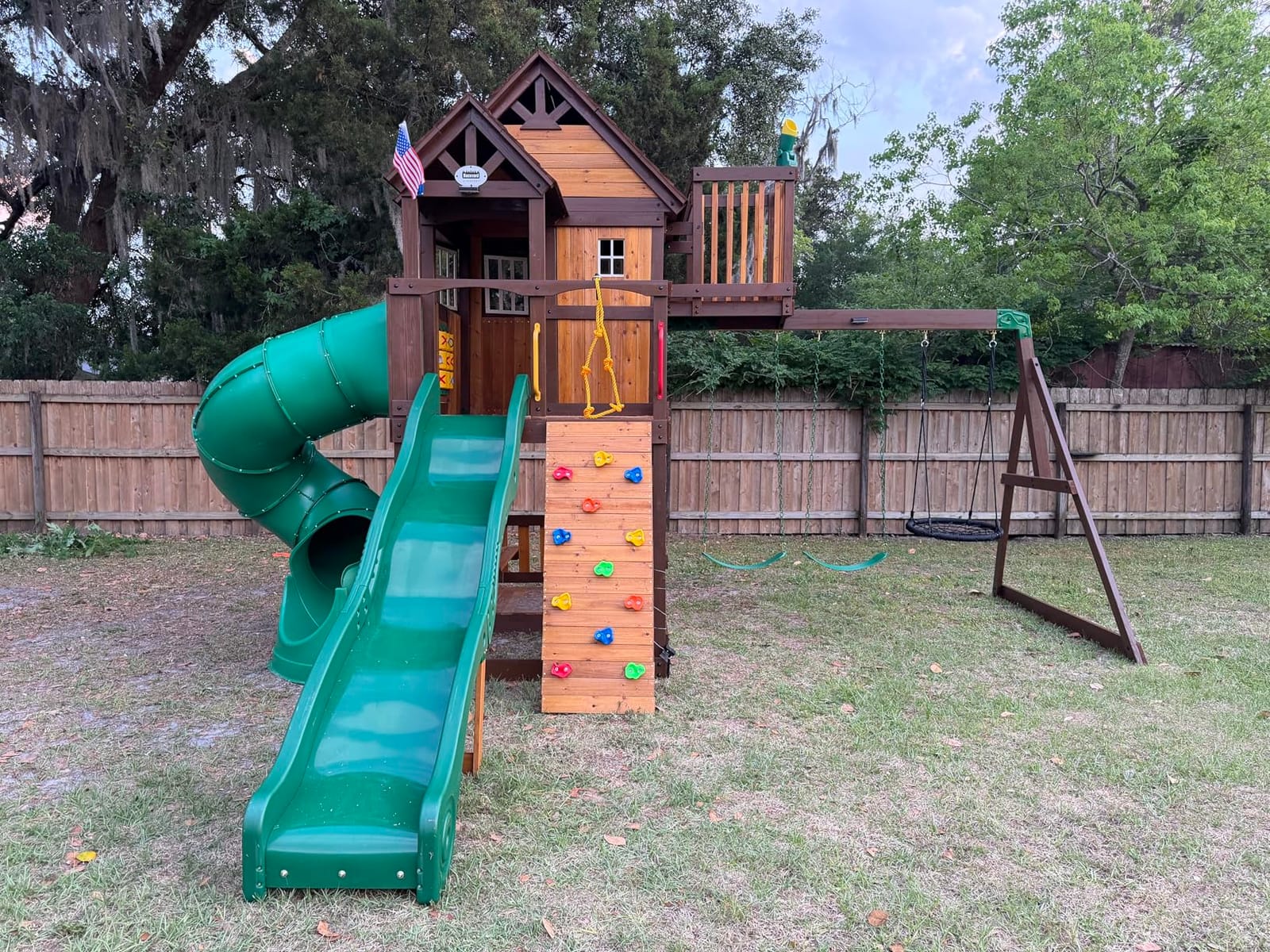 Backyard Discovery Skyfort All Cedar Swing Set, Elevated Covered Wood Roof Clubhouse with Bay Windows, 2 Belt Swings, Web Swing, 10ft Wave Slide, 5 ft Tube Slide, Covered Picnic Table, 5 ft Rock Wall customer photo 1