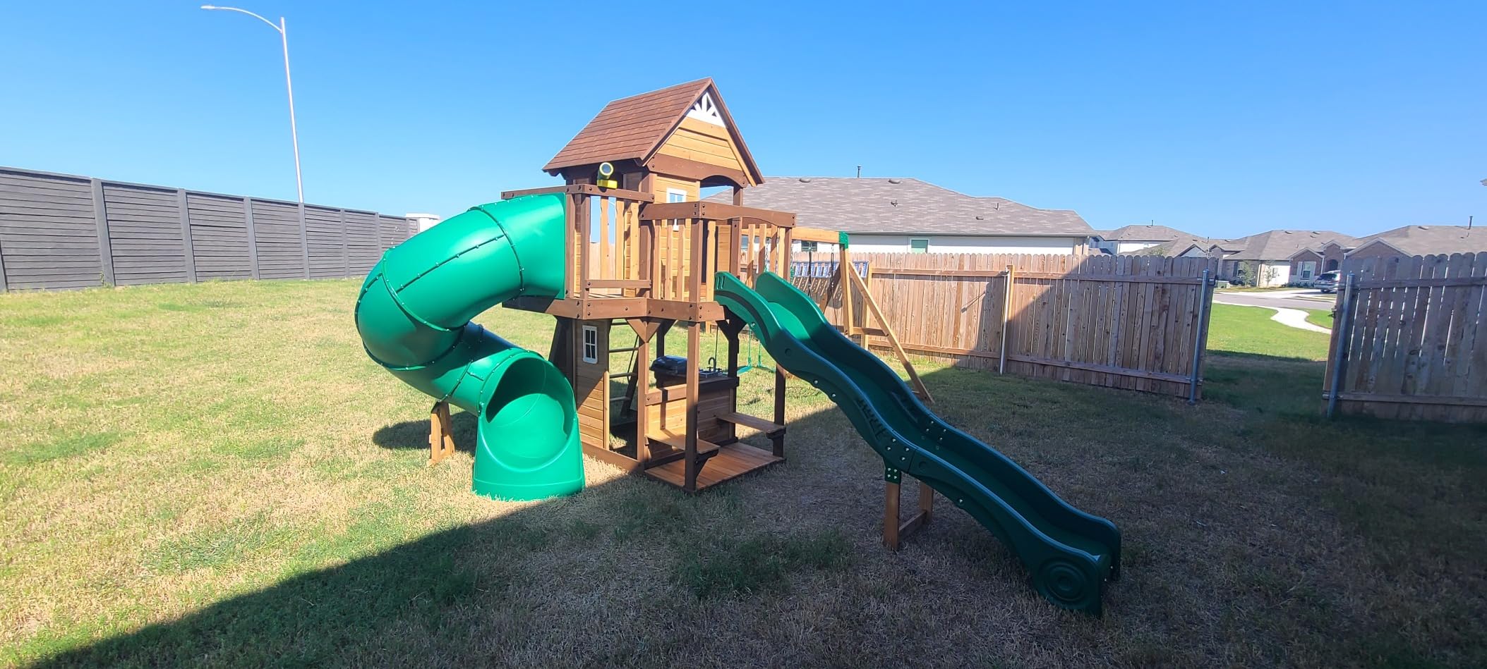 Backyard Discovery Cedar Cove Cedar Wood Swing Set with Spiral Tube Slide, Wave Slide, Clubhouse, Toy Grill, Snack Bar, Rock Wall, Belt Swings, Web Swing, Balcony, Chalkboard, Ladder, Outdoor Playset customer photo 1