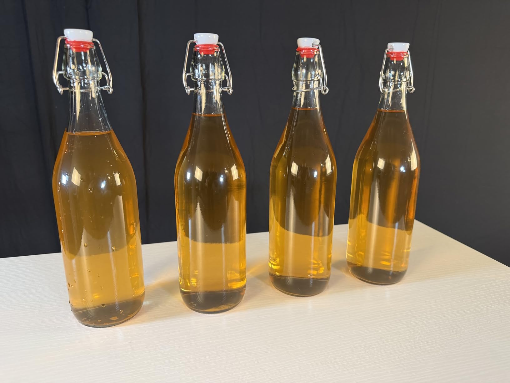 8 PACK [1 Liter/33 fl. oz.] Swing Top Glass Bottles w/ 2 Funnels & Pourers | Airtight Flip Top Brewing Fermentation Bottle for Beverages, Kombucha, Soda, Beer, Coquito, Kefir, Wine, Carbonated Drinks customer photo 2